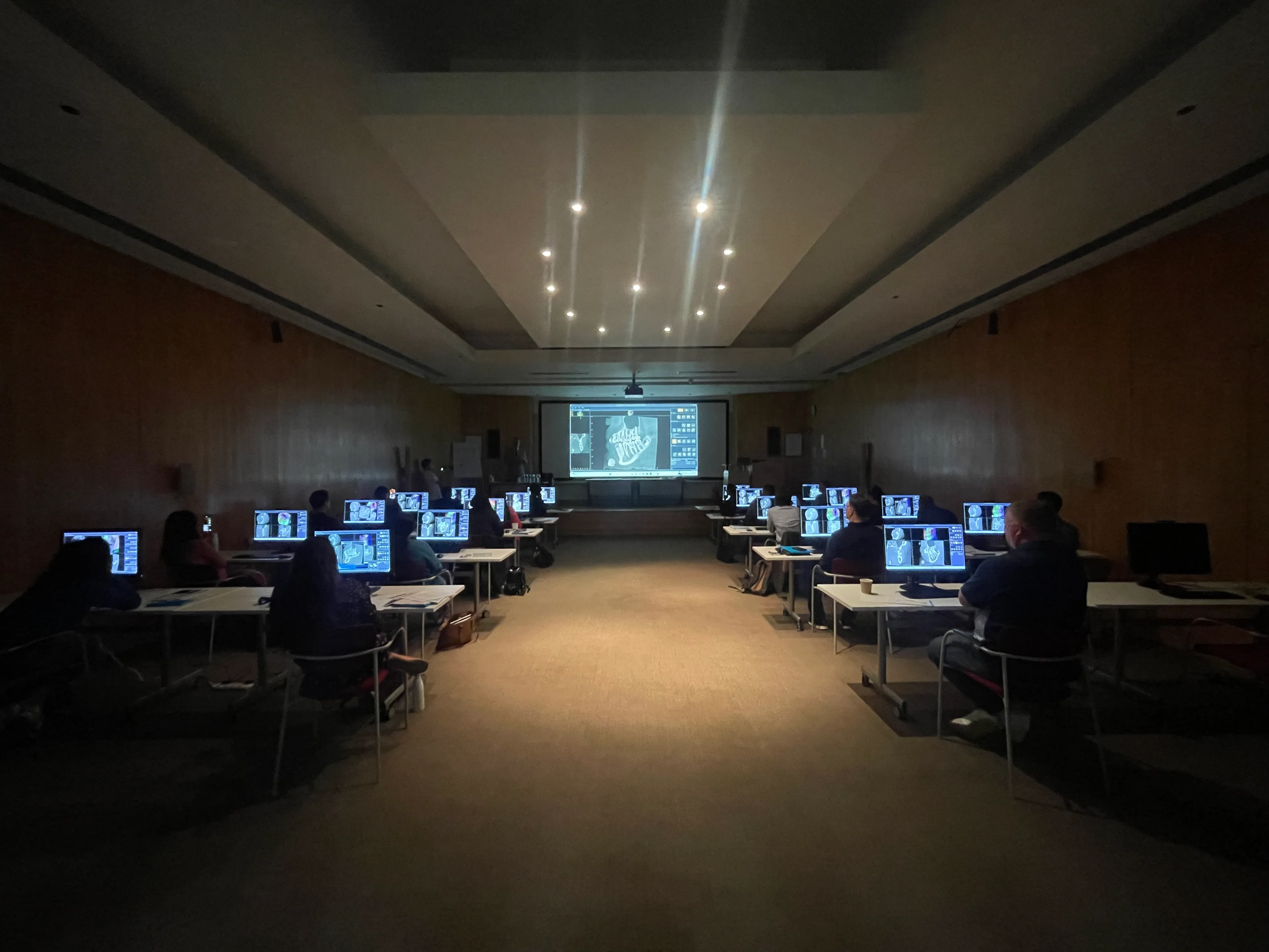 Delegates reviewing CBCT scans on screen at one of Professor Patel's hands-on imaging masterclasses